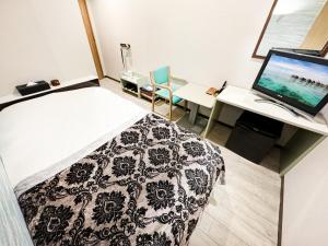 Letto o letti in una camera di Hotel BaliBali Matsudo