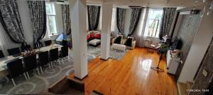 an aerial view of a living room with windows at My house in Ganja