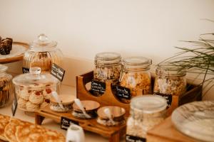 a room with jars of food and bread on tables at BAYIT Charming Place in Polignano a Mare