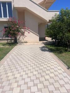a walkway in front of a house at Boci studio apartments in Ulcinj