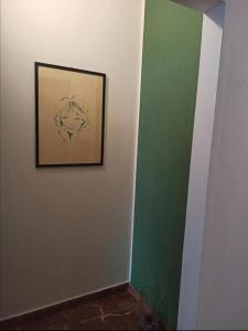 a hallway with a picture on a wall at Casa del Sole in Mondragone