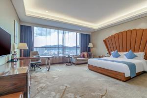 Ένα ή περισσότερα κρεβάτια σε δωμάτιο στο GuangZhou TongYu International Hotel +26 φωτογραφίες