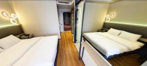 Postel nebo postele na pokoji v ubytování Theodosius Hotel