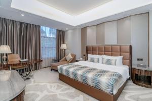 Ένα ή περισσότερα κρεβάτια σε δωμάτιο στο GuangZhou TongYu International Hotel