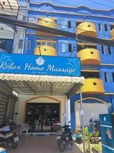 a blue building with a sign that reads relax home massage at Relax home massage Ao nang 1 in Ao Nang  +3 photos