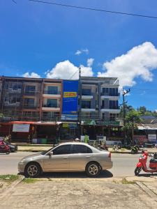 a car parked in a parking lot in front of a building at Relax home massage Ao nang 1 in Ao Nang 