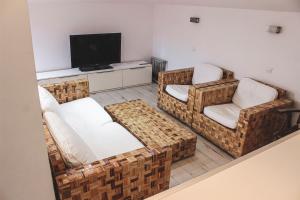 TV a/nebo společenská místnost v ubytování Family Hotel Casa del Mare