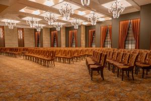 an empty hall with chairs and chandeliers in it at Sile Gonen Hotel in Şile +37 photos