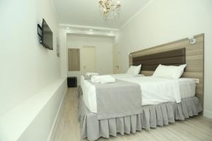 Postel nebo postele na pokoji v ubytování Royal Medis Hotel