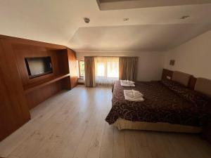 Postel nebo postele na pokoji v ubytování Family Hotel Casa del Mare