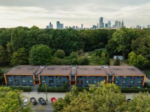 an apartment building with a city in the background at The Park Suites in Warsaw