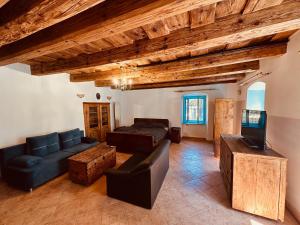 a living room with a couch and a bed at Zázrak in Banská Štiavnica