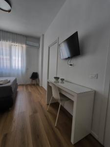 TV a/nebo společenská místnost v ubytování Faber Home