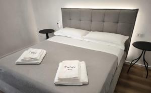 Postel nebo postele na pokoji v ubytování Faber Home