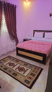 Postel nebo postele na pokoji v ubytování Luxor Star Apartments