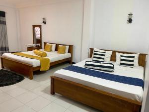 Postel nebo postele na pokoji v ubytování Sohili 3R Resort Ella