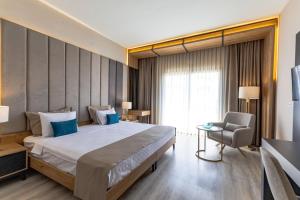 Postel nebo postele na pokoji v ubytování PARADISOS HOTEl