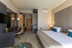 Postel nebo postele na pokoji v ubytování PARADISOS HOTEl