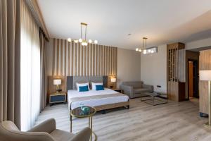 Postel nebo postele na pokoji v ubytování PARADISOS HOTEl