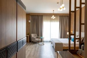 Postel nebo postele na pokoji v ubytování PARADISOS HOTEl
