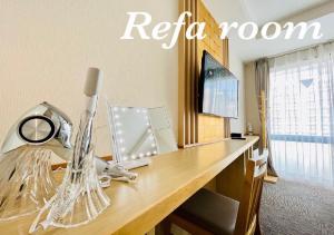 Sjónvarps- og/eða afþreyingartæki á Henn na Hotel Premier Kyoto Eki Hachijoguchimae