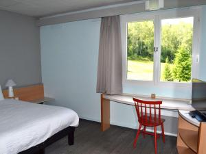 Postel nebo postele na pokoji v ubytování ibis Egletons