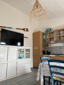 Η κουζίνα ή μικρή κουζίνα στο Attico aMare Costa Rei - 100m dalla spiaggia +21 φωτογραφίες