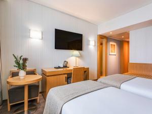 Ein Bett oder Betten in einem Zimmer der Unterkunft Mercure Lisboa Almada