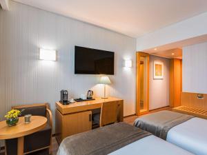 Ein Bett oder Betten in einem Zimmer der Unterkunft Mercure Lisboa Almada