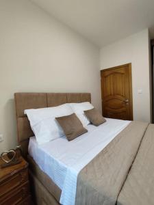 Giường trong phòng chung tại Vidikovac