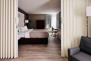A bed or beds in a room at Quality Inn