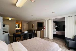 A bed or beds in a room at Quality Inn