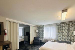 A bed or beds in a room at Quality Inn