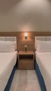 Voodi või voodid majutusasutuse شقق هوليداي بلس مشرفه - Holiday Plus Mishrifah Apartments toas