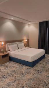 Voodi või voodid majutusasutuse شقق هوليداي بلس مشرفه - Holiday Plus Mishrifah Apartments toas