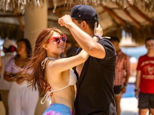 a man and a woman dancing at a beach at Marival Emotions Resort & Suites Riviera Nayarit by Mercure in Nuevo Vallarta +37 photos