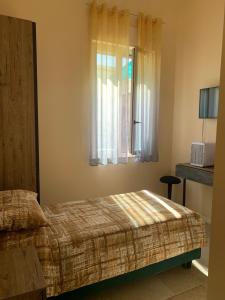 Postel nebo postele na pokoji v ubytování B&B Mercadante