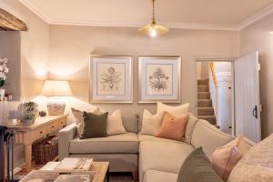 a living room with a couch and a table at Danes Cottage - Luxury Peak District Retreat in Chapel en le Frith +93 photos