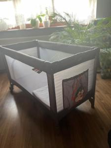 a bed frame with a picture of ariel on it at Apartament ZIELONY TARAS in Kielce +7 photos