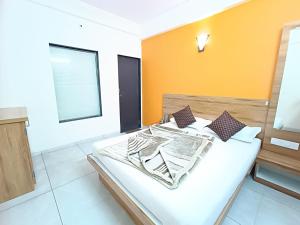 Un pat sau paturi într-o cameră la Ramai Cottage