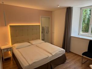 Postel nebo postele na pokoji v ubytování Lindenhof Residence Meran