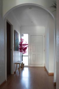 a room with a table and a door with a tree at Villa Cruceiro in Los Belones