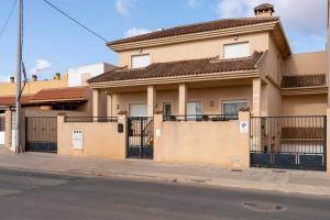 a house on the side of a street at Villa Cruceiro in Los Belones