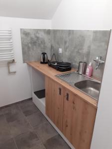 a kitchen with a sink and a counter top at Agroturystyka Izby in Izby