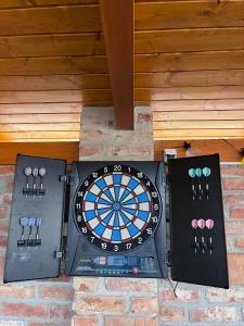a dart board on top of a brick wall at Ikervár-lak in Ikervár
