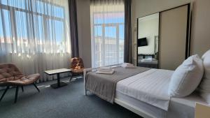 Postel nebo postele na pokoji v ubytování Prime Hotel