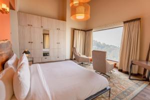 Voodi või voodid majutusasutuse The Manor Luxury Apartments, Shimla toas