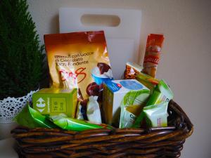 a basket filled with food and other snacks at B&B Cernaia 42 in La Spezia