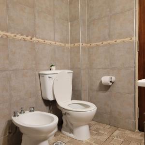 a bathroom with a toilet and a sink at AP CENTRO in San Juan