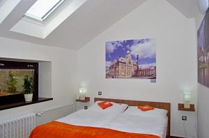 Postel nebo postele na pokoji v ubytování Hotel Pod Radnicí